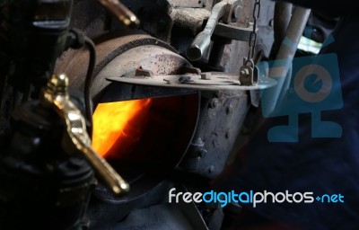 Coal Burning Inside A Traditional Stream Train Stock Photo