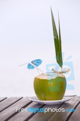 Coconut Water Drink Served In Coconut With Drinking Straw On The… Stock Photo