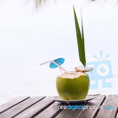 Coconut Water Drink Served In Coconut With Drinking Straw On The… Stock Photo