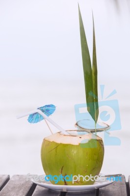 Coconut Water Drink Served In Coconut With Drinking Straw On The… Stock Photo