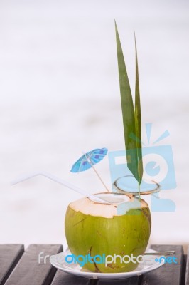 Coconut Water Drink Served In Coconut With Drinking Straw On The… Stock Photo