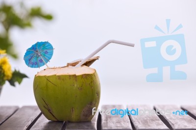 Coconut Water Drink Served In Coconut With Drinking Straw On The… Stock Photo