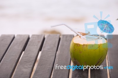 Coconut Water Drink Served In Coconut With Drinking Straw On The… Stock Photo