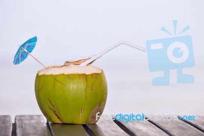 Coconut Water Drink Served In Coconut With Drinking Straw On The… Stock Photo