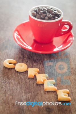 Coffee Alphabet Biscuit With Red Coffee Cup Stock Photo