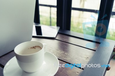 Coffee And Blur Laptop On Table In Retro Style Stock Photo