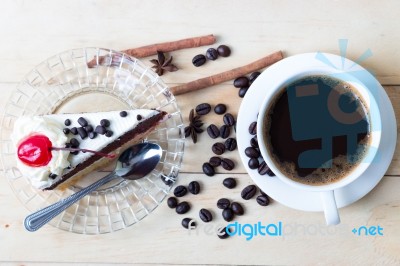 Coffee And Cake Sweets Dessert On Wood Desk In Morning Stock Photo