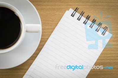 Coffee And Notepad On Wood Table Stock Photo