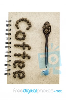 Coffee Bean Arrange In Coffee Word With Spoon And Small Cup Stock Photo