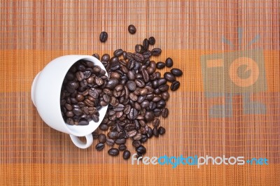 Coffee Bean Cup Spill Over Stock Photo