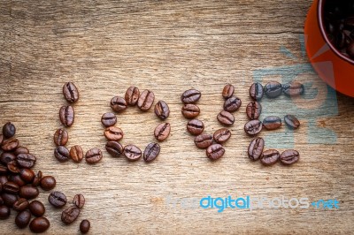 Coffee Bean Love On The Wooden Floor Stock Photo