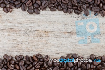 Coffee Bean On Grain Wood Stock Photo