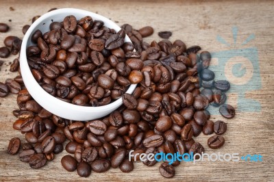 Coffee Bean On The Wooden Floor Stock Photo