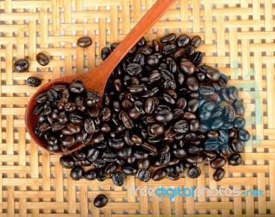 Coffee Bean With Wooden Spoon On Wood Background Stock Photo