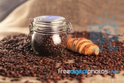 Coffee Beans And Croissant Stock Photo