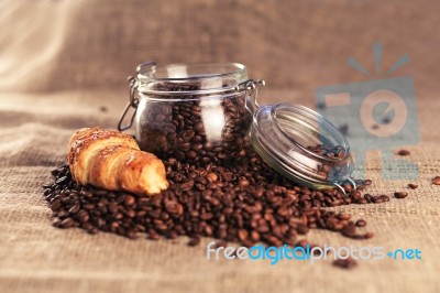 Coffee Beans And Croissant Stock Photo