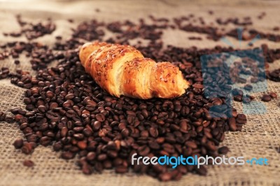 Coffee Beans And Croissant Stock Photo