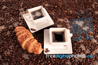 Coffee Beans And Croissant Stock Photo