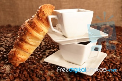 Coffee Beans And Croissant Stock Photo