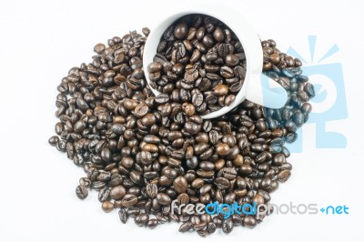 Coffee Beans In Coffee Cup Isolated On White Stock Photo