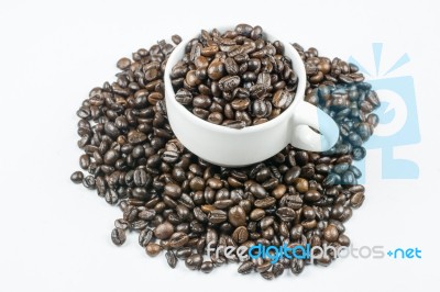 Coffee Beans In Coffee Cup Isolated On White Stock Photo