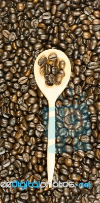 Coffee Beans In Olive Wood Spoon Stock Photo