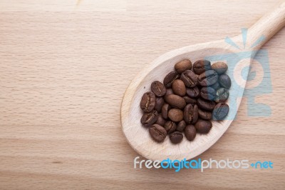 Coffee Beans In Spoon Stock Photo