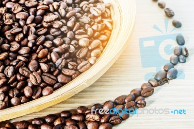 Coffee Beans On A Wood Plate Stock Photo