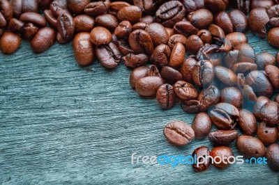 Coffee Beans On The Wooden Floor Stock Photo