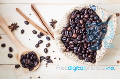 Coffee Beans On Wood Table Stock Photo