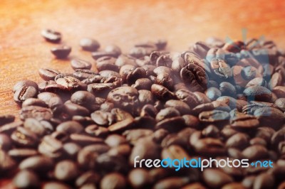 Coffee Beans On Wooden Stock Photo