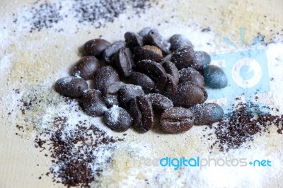 Coffee Beans Sugar And Creamer On Wood Background Stock Photo