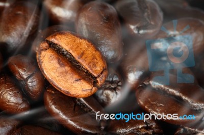 Coffee Beans With Smoke Of Aroma Stock Photo