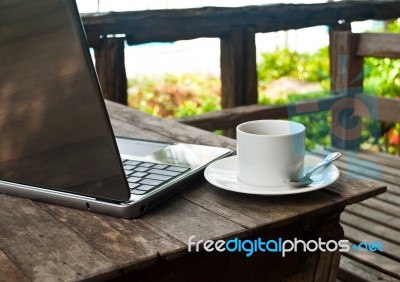 Coffee Cup And Laptop Stock Photo