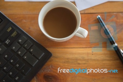 Coffee Cup And Laptop For Business, Selective Focus On Coffee And Using Filter Photo Effect Stock Photo