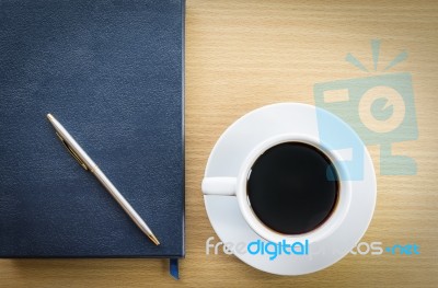 Coffee Cup And Notebook Stock Photo