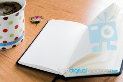 Coffee Cup And Notebook On Wooden Table With Copy Space Stock Photo