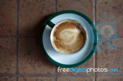 Coffee Cup On Ceramic Table Stock Photo