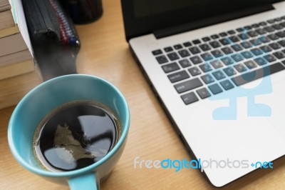 Coffee Cup On Table Wood With Bulr Labtop And Book Stock Photo