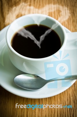 Coffee Cup On Wooden Table Stock Photo