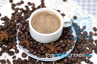 Coffee Cup With Spreaded Beans Stock Photo