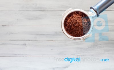 Coffee Grind In Group On White Wooden Background Stock Photo