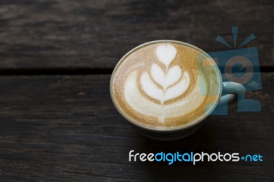 Coffee Late Art On Dark Wooden Floor Stock Photo