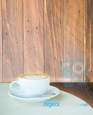 Coffee Latte Cup On Corner Of Wooden Background Stock Image