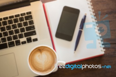 Coffee Latte On Work Table Stock Photo