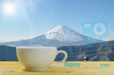 Coffee Mug On A Wooden Floor Stock Photo