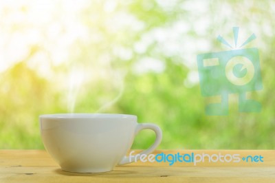 Coffee Mug On A Wooden Floor Stock Photo