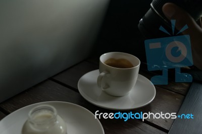 Coffee On Table Wood And The Man Using Camera Stock Photo