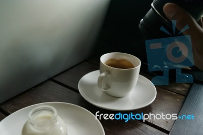 Coffee On Table Wood And The Man Using Camera Stock Photo