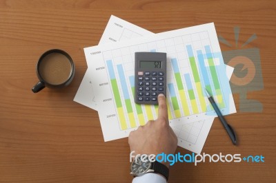 Coffee On Worktable Covered With Documents Close Up Stock Photo